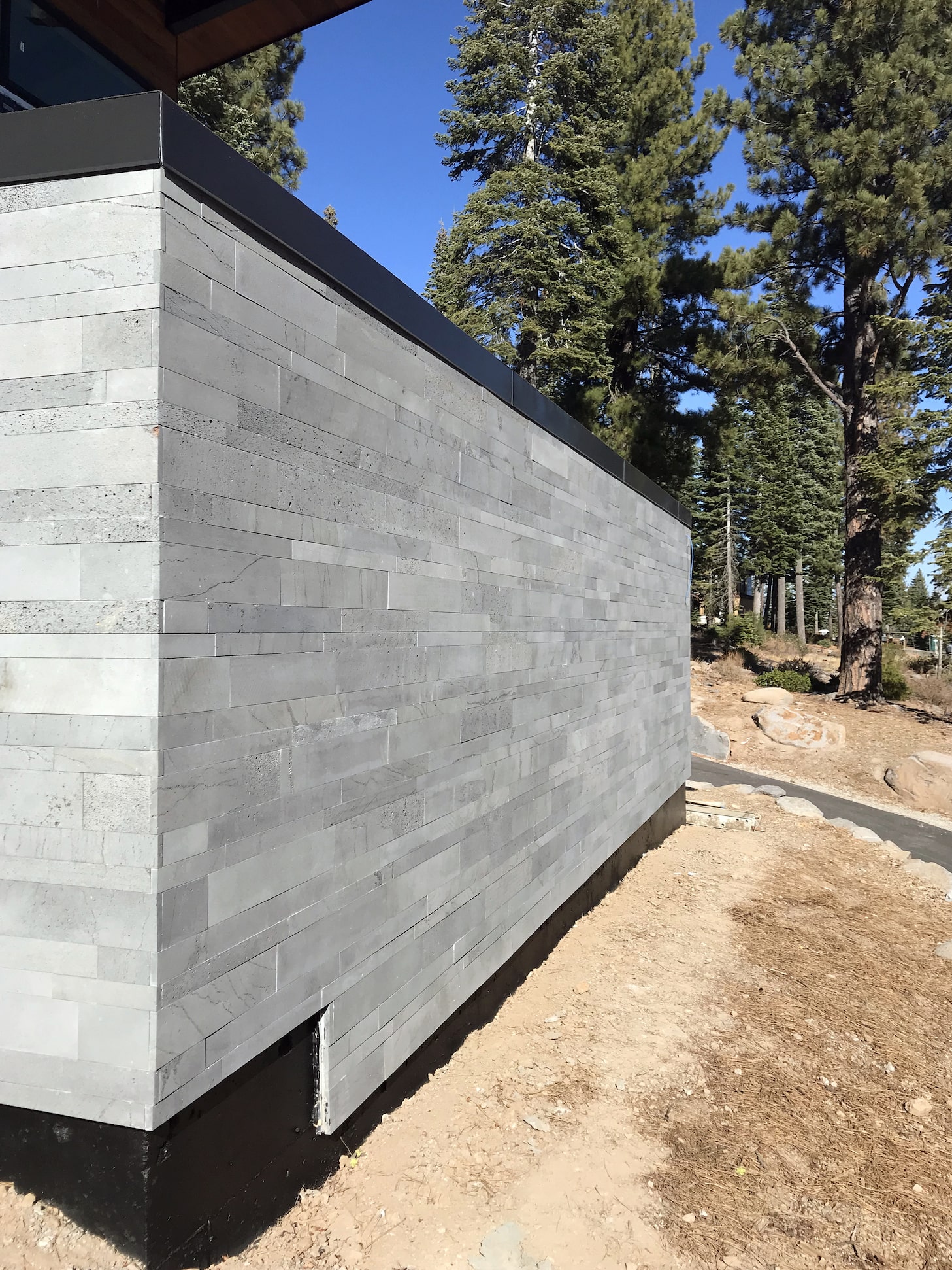 Norstone Platinum Planc Large Format Tile on an exterior feature wall in modern designed hillside home in Reno